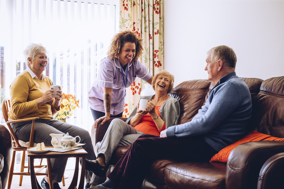 A self-employed carer supporting a client at home